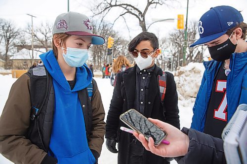 MIKE DEAL / WINNIPEG FREE PRESS
(from l-r) Nathan Iwanchuk, Devon Francisco, and Liam Thomson, grade 9 students from Kelvin High School took part in the walkout along with around 100 other students during the middle of class to raise awareness of lack of student safety. The walkout was organized by students at more than 75 schools.
See Maggie Macintosh story
220117 - Monday, January 17, 2022.