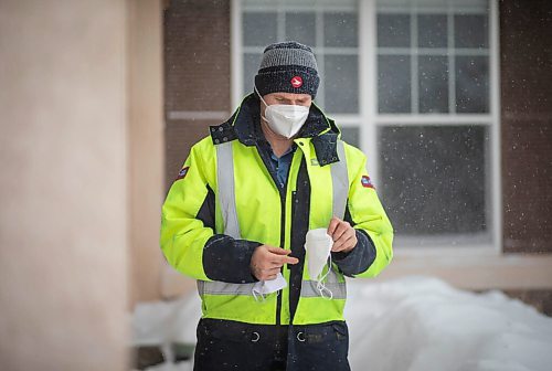 JESSICA LEE / WINNIPEG FREE PRESS

Letter-carrier Corey Gallagher poses for a photo at his home on January 18, 2022. He was sent home earlier in the day from his work at Canada Post because his boss said he couldnt wear a medical grade N95 to work. The supervisors and superintendent insisted he wear the provided cloth mask he is holding in his left hand. He holds the N95 he was initially wearing to work in his other hand. 

Reporter: Dylan






