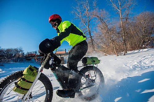 MIKAELA MACKENZIE / WINNIPEG FREE PRESS

Daniel Perry, who recently finished a 160 mile winter endurance cycling race, rides his bike in Winnipeg on Wednesday, Jan. 19, 2022. For Ben Waldman story.
Winnipeg Free Press 2022.