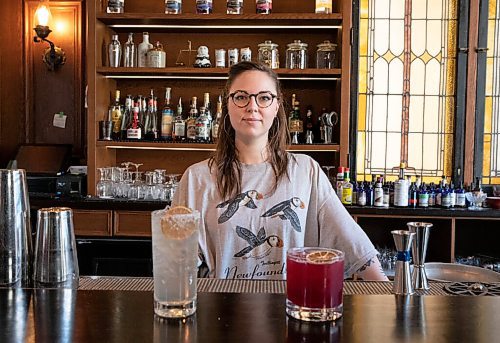 JESSICA LEE / WINNIPEG FREE PRESS

Callan Anderson, a bartender, poses with the drinks she made on January 20, 2022 at Patent 5. On the left is the Young Grasshopper and on the right is the Violet Beauregard.

Reporter: Declan





