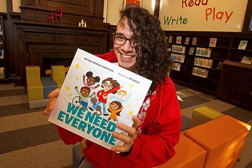 MIKE DEAL / WINNIPEG FREE PRESS
Ininew speaker/community organizer Michael Redhead Champagne, at the St. John's Library, with the cover of his children's book, We Need Everyone, which is available for pre-order.
See Jen Zoratti story
220124 - Monday, January 24, 2022.