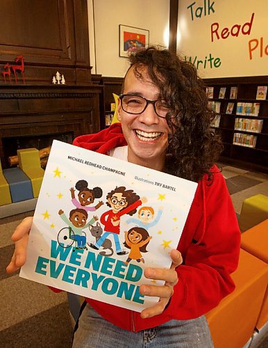 MIKE DEAL / WINNIPEG FREE PRESS
Ininew speaker/community organizer Michael Redhead Champagne, at the St. John's Library, with the cover of his children's book, We Need Everyone, which is available for pre-order.
See Jen Zoratti story
220124 - Monday, January 24, 2022.