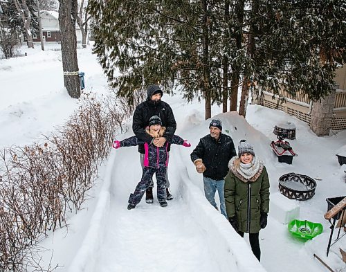 JESSICA LEE / WINNIPEG FREE PRESS

Kaya Raimbault (front left) is photographed with her family mom Terena Caryk (right) and dad Mike Raimbault (left) at the ice castle she built with the help of her neighbour Maurice "Mo" Barriault (second from right) on January 21, 2022.

Reporter: Melissa





