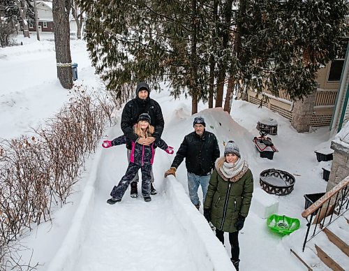 JESSICA LEE / WINNIPEG FREE PRESS

Kaya Raimbault (front left) is photographed with her family mom Terena Caryk (right) and dad Mike Raimbault (left) at the ice castle she built with the help of her neighbour Maurice "Mo" Barriault (second from right) on January 21, 2022.

Reporter: Melissa





