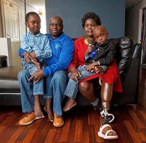 MIKE DEAL / WINNIPEG FREE PRESS
Mariam Yide and her husband, Moses Tabe, with their sons, Dani, 5, Golyam, 3.
Mariam survived COVID and she wants others to realize it is not just a cold or flu.
The home-care worker caught COVID before vaccines were available. She was pregnant. She went into a weeks-long coma, during which she lost her baby and had some fingers from both hands, her leg below the knee, and part of her other foot amputated. 
See Kevin Rollason story.
220126 - Wednesday, January 26, 2022.