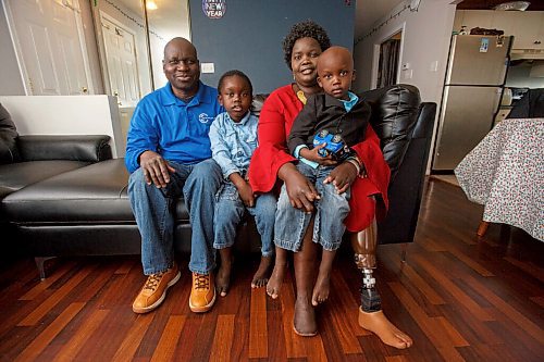 MIKE DEAL / WINNIPEG FREE PRESS
Mariam Yide and her husband, Moses Tabe, with their sons, Dani, 5, Golyam, 3.
Mariam survived COVID and she wants others to realize it is not just a cold or flu.
The home-care worker caught COVID before vaccines were available. She was pregnant. She went into a weeks-long coma, during which she lost her baby and had some fingers from both hands, her leg below the knee, and part of her other foot amputated. 
See Kevin Rollason story.
220126 - Wednesday, January 26, 2022.