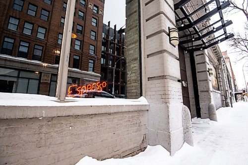 Mike Sudoma / Winnipeg Free Press
A lit up espresso sign shines in the window of Dealers Choice Coffee Wednesday afternoon
January 26, 2022