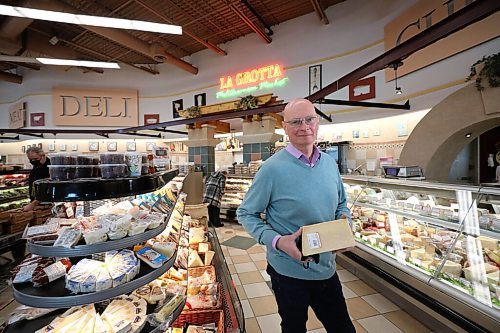 RUTH BONNEVILLE / WINNIPEG FREE PRESS

 BIZ - de nardi

Tom De Nardi, co-head of Mondo Foods and Piazza De Nardi holds a brick of cheese from Europe  which is just one of the items they are beginning to see shortages due to supply chain issues. 
?
Gabby Piché story.

Jan 27th,  2022