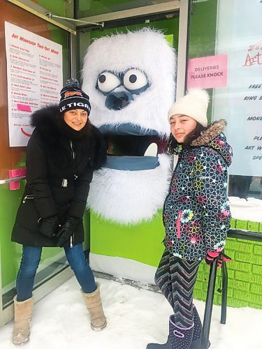Canstar Community News Marina Havard and her 11-year old daughter, Zen, wait to receive art kits from Art Citys friendly yeti.