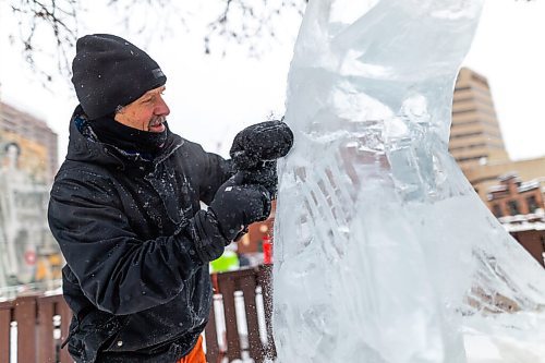 Daniel Crump / Winnipeg Free Press. Daniel Friesen and Helen Friesen carve a goldeye out of a block of ice on Broadway near Gary Street. The ice is sourced from the Red River and the project is part of an exhibit called Winter Wanderland, a joint venture between Downtown Winnipeg BIZ and Sputnik Architecture. January 29, 2022.