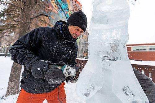 Daniel Crump / Winnipeg Free Press. Daniel Friesen and Helen Friesen carve a goldeye out of a block of ice on Broadway near Gary Street. The ice is sourced from the Red River and the project is part of an exhibit called Winter Wanderland, a joint venture between Downtown Winnipeg BIZ and Sputnik Architecture. January 29, 2022.