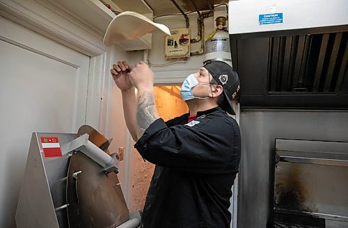 JESSICA LEE / WINNIPEG FREE PRESS

Jack Colombe, co-owner of Thompson-Style Pizza, makes a Shane Special on January 28, 2022, named for Colombes brother who took his own life three years ago.

Reporter: Dave




