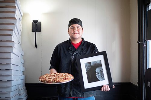 JESSICA LEE / WINNIPEG FREE PRESS

Jack Colombe, co-owner of Thompson-Style Pizza, holds a Shane Special and a photo of his brother on January 28, 2022. The Shane Special is named for Colombes brother who took his own life three years ago.

Reporter: Dave



