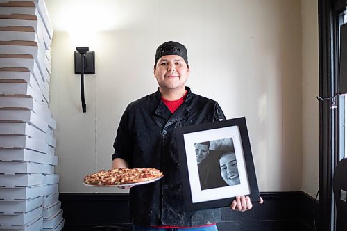JESSICA LEE / WINNIPEG FREE PRESS

Jack Colombe, co-owner of Thompson-Style Pizza, holds a Shane Special and a photo of his brother on January 28, 2022. The Shane Special is named for Colombes brother who took his own life three years ago.

Reporter: Dave



