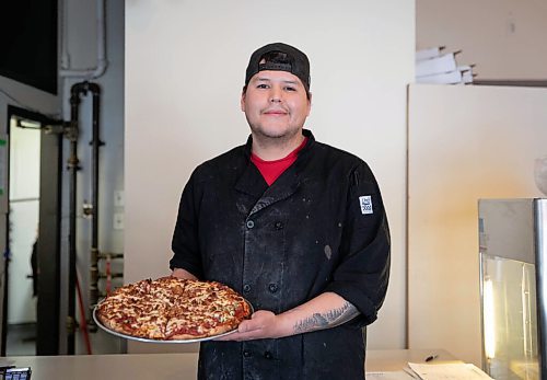 JESSICA LEE / WINNIPEG FREE PRESS

Jack Colombe, co-owner of Thompson-Style Pizza, holds a Shane Special on January 28, 2022, named for Colombes brother who took his own life three years ago.

Reporter: Dave




