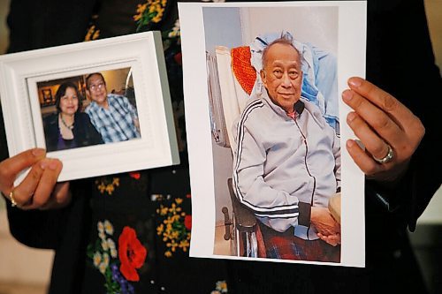 JOHN WOODS / WINNIPEG FREE PRESS
Melissa Carter holds family photos after she spoke about her elderly father at a press conference at the Manitoba Legislature, Monday, January 31, 2022. Mr. Apalit was transferred from Concordia Hospital to Minnedosa.

Re: Danielle