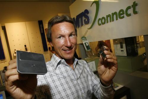 MIKE.DEAL@FREEPRESS.MB.CA 100709 - Friday, July 09, 2010 -  Barry Olinyk, General Manager Advance Electronics, holds up two of the legal options drivers can use if they feel the need to talk on the phone while driving. (l-r) A bluetooth visor attached speaker phone option and a bluetooth ear piece option. Both allow drivers to talk on the phone hands free. See Melissa Martin story MIKE DEAL / WINNIPEG FREE PRESS