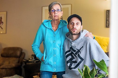 MIKAELA MACKENZIE / WINNIPEG FREE PRESS

Wendy Petrushak and her son, Graeme Mohr, pose for a photo in her condo, which they had to flee because of the Kimberly fire, in Winnipeg on Tuesday, Feb. 1, 2022. For Chris Kitching story.
Winnipeg Free Press 2022.