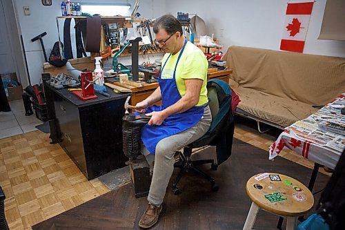 MIKE DEAL / WINNIPEG FREE PRESS
Nikolay taps a nail into a new heel.
Genoveva Karapeneva and Nikolay Karapenev in their shoe repair shop Wednesday morning.
moved to Winnipeg from Bulgaria in 2016, where their only daughter (and only grandson) were already living. The couple had been in the shoe-repair biz for most of their working lives already, so after spending close to a year learning how to speak English, they opened a shop in Old St. Vital and, during the height of COVID, got their Canadian citizenship during a Zoom ceremony.
See Dave Sanderson story
220202 - Wednesday, February 02, 2022.