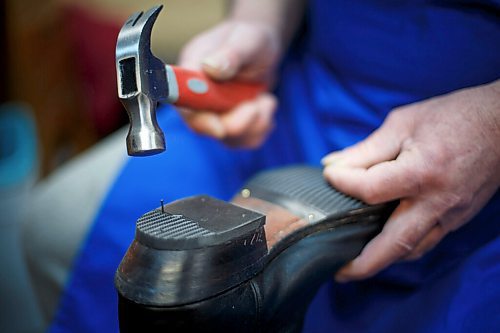 MIKE DEAL / WINNIPEG FREE PRESS
Nikolay taps a nail into a new heel.
Genoveva Karapeneva and Nikolay Karapenev in their shoe repair shop Wednesday morning.
moved to Winnipeg from Bulgaria in 2016, where their only daughter (and only grandson) were already living. The couple had been in the shoe-repair biz for most of their working lives already, so after spending close to a year learning how to speak English, they opened a shop in Old St. Vital and, during the height of COVID, got their Canadian citizenship during a Zoom ceremony.
See Dave Sanderson story
220202 - Wednesday, February 02, 2022.