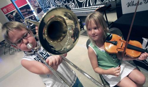 MIKE.DEAL@FREEPRESS.MB.CA 100710 - Saturday, July 10, 2010 -  Daniel, 9, and sister Sarah Vandermeulen, 7, try out the various orchestral instruments at the special "petting zoo" hosted by the WSO in the Shakin' All Over exhibit at the Manitoba Museum Saturday afternoon. MIKE DEAL / WINNIPEG FREE PRESS