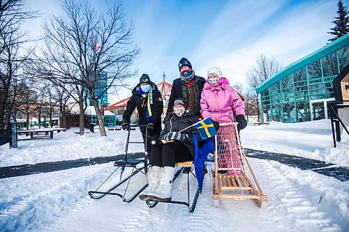 MIKAELA MACKENZIE / WINNIPEG FREE PRESS

Urban Ahlin, the Swedish Ambassador to Canada (left), Anders Swanson of Trails Winnipeg, Marilyn Ekelund, Swedish Association board member (seated), and Sonja Lundstrom, Swedish Cultural Association of Manitoba president, go on a kicksledding jaunt around The Forks in Winnipeg on Thursday, Feb. 3, 2022. For Eva Wasney story.
Winnipeg Free Press 2022.