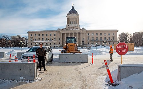 MIKE DEAL / WINNIPEG FREE PRESS
A front-end loader pushes concrete barriers into position in anticipation of the "trucker" protest Friday morning at the Manitoba Legislative building.
220203 - Thursday, February 03, 2022.