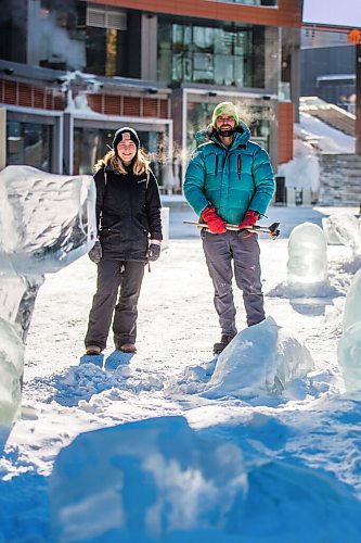 MIKAELA MACKENZIE / WINNIPEG FREE PRESS

Pamela Hardman with the Downtown BIZ and sculptor Peter Hargraves pose for a portrait by an ice sculpture of belugas at True North Square in Winnipeg on Friday, Feb. 4, 2022. For Kevin story.
Winnipeg Free Press 2022.