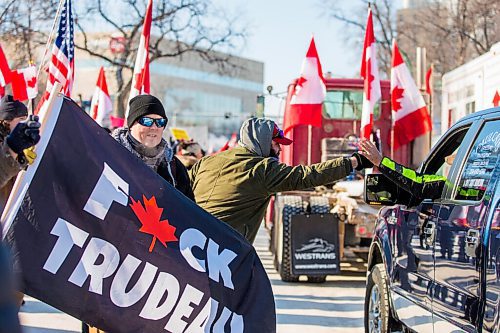 MIKAELA MACKENZIE / WINNIPEG FREE PRESS

Folks rally against vaccine mandates and in support of truckers outside of the Manitoba Legislative Building in Winnipeg on Friday, Feb. 4, 2022. For Carol/Danielle story.
Winnipeg Free Press 2022.