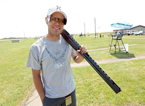 Brandon Sun 11072010 Trap Shooter Pat Lamont poses for a photo prior to competition at the Provincial Trap Shooting Championships at the Winchester Shooting Complex south of Brandon on Sunday. Lamont, of Brandon, is one of the top trap shooters in North America.  (Tim Smith/Brandon Sun)
