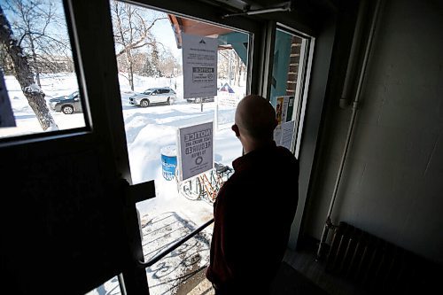 JOHN WOODS / WINNIPEG FREE PRESS
Lansing Robertson looks out of his Kennedy Street apartment at protestors who continue to rally against COVID mandates on Broadway in front of the Manitoba Legislature, Sunday, February 6, 2022. 

Re: Piche