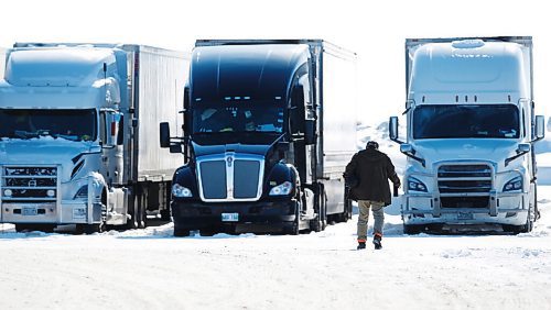 JOHN WOODS / WINNIPEG FREE PRESS
A working driver heads to his truck at a truck stop on Portage Avenue in Headingley, Sunday, February 6, 2022. 

Re: Piche
