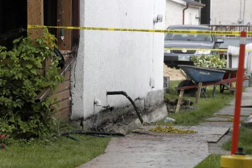 MIKE.DEAL@FREEPRESS.MB.CA 100713 - Tuesday, July 13, 2010 -  A man was injured in a workplace accident when a concrete slab fell on him while he was in a trench alongside a house at 207 Bertrand Street. MIKE DEAL / WINNIPEG FREE PRESS