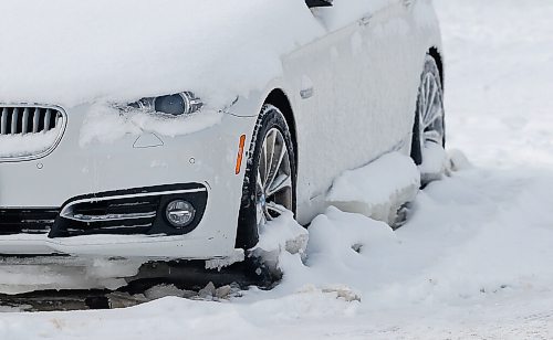 JOHN WOODS / WINNIPEG FREE PRESS
A car that was frozen in place due to a waterman break on Fulton Street Sunday, February 6, 2022. Crews were called to work on fixing a watermain break on a residents property. Residents allege water had been flowing uncontrolled for a week.

Re: Piche