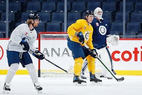JOHN WOODS / WINNIPEG FREE PRESS
Winnipeg Jets' Kyle Connor (81), Logan Stanley (64) and goaltender Connor Hellebuyck (37) at practice at their arena in downtown Winnipeg, Monday, February 7, 2022. 

Re: McIntyre