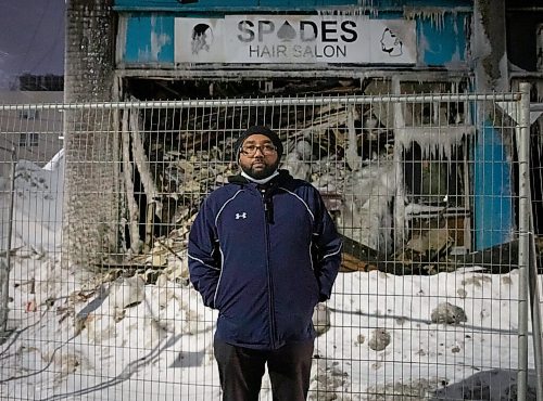 JESSICA LEE / WINNIPEG FREE PRESS

Yared Teklezigi poses for a photo on February 9, 2022 outside of the salon and nightclub he owned.The building that housed the salon and nightclub was damaged by a fire on February 2, 2022. The building is covered with ice from the water the firefighters used to put out the flames.

Reporter: Ben




