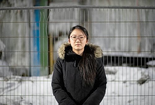 JESSICA LEE / WINNIPEG FREE PRESS

Xinyu Shen poses for a photo on February 9, 2022 outside of the donut shop she co-owned with her partner. The shop opened not long ago last year. The building that housed her shop was damaged by a fire on February 2, 2022. The building is covered with ice from the water the firefighters used to put out the flames.

Reporter: Ben
