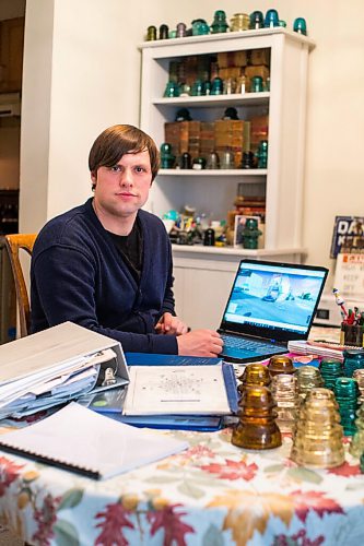 MIKAELA MACKENZIE / WINNIPEG FREE PRESS

Chris Sweryda, who has compiled information on hundreds of Winnipeg intersections, poses for a portrait in his home in Winnipeg on Wednesday, Feb. 9, 2022. For Ryan Thorpe story.
Winnipeg Free Press 2022.