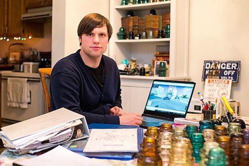 MIKAELA MACKENZIE / WINNIPEG FREE PRESS

Chris Sweryda, who has compiled information on hundreds of Winnipeg intersections, poses for a portrait in his home in Winnipeg on Wednesday, Feb. 9, 2022. For Ryan Thorpe story.
Winnipeg Free Press 2022.