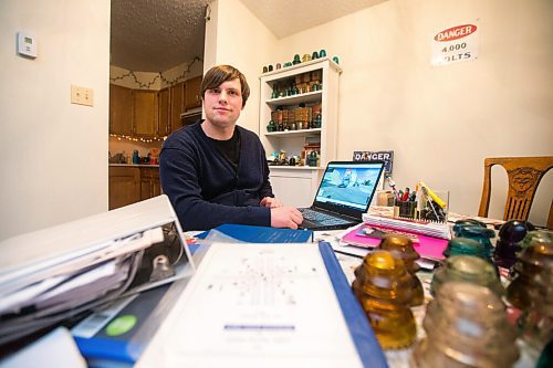 MIKAELA MACKENZIE / WINNIPEG FREE PRESS

Chris Sweryda, who has compiled information on hundreds of Winnipeg intersections, poses for a portrait in his home in Winnipeg on Wednesday, Feb. 9, 2022. For Ryan Thorpe story.
Winnipeg Free Press 2022.