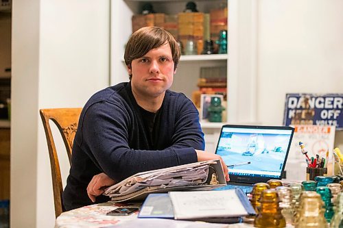 MIKAELA MACKENZIE / WINNIPEG FREE PRESS

Chris Sweryda, who has compiled information on hundreds of Winnipeg intersections, poses for a portrait in his home in Winnipeg on Wednesday, Feb. 9, 2022. For Ryan Thorpe story.
Winnipeg Free Press 2022.