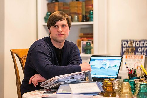 MIKAELA MACKENZIE / WINNIPEG FREE PRESS

Chris Sweryda, who has compiled information on hundreds of Winnipeg intersections, poses for a portrait in his home in Winnipeg on Wednesday, Feb. 9, 2022. For Ryan Thorpe story.
Winnipeg Free Press 2022.