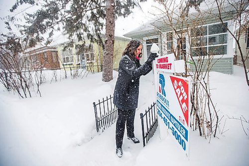 MIKAELA MACKENZIE / WINNIPEG FREE PRESS

Renée Robidoux Kapitoler, real estate agent, poses for a portrait in front of a house that will be coming on the market soon in Winnipeg on Thursday, Feb. 10, 2022. Shes never seen the housing market as crazy in January/February than this year (and maybe last). For Gabby Piche story.
Winnipeg Free Press 2022.