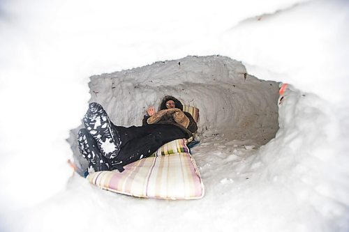 MIKAELA MACKENZIE / WINNIPEG FREE PRESS

Alex Wiebe, who loves embracing the winter elements, poses for a portrait in his backyard quinzhee in Winnipeg on Thursday, Feb. 10, 2022. . For Declan story.
Winnipeg Free Press 2022.