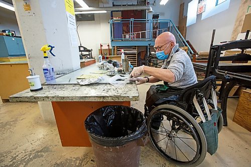 MIKE DEAL / WINNIPEG FREE PRESS
Ted Howorth is a printmaker and wheelchair user who was involved in the consultation process for an arts venue audit created by the Arts Accessibility Network Manitoba. The audit aims to give venue operators ways to make their space more accessible for patrons and artists with disabilities.
At the Martha Street Studio, Ted, works on printing one of his mezzotint plates Monday afternoon. The printing studio is in the basement of the building and requires him to use an elevator to gain access. The majority of the equipment is already somewhat accessible to him with only the odd item that is requires a bit more effort to access.
See Eva Wasney story
220214 - Monday, February 14, 2022.