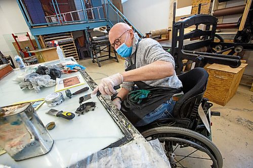MIKE DEAL / WINNIPEG FREE PRESS
Ted Howorth is a printmaker and wheelchair user who was involved in the consultation process for an arts venue audit created by the Arts Accessibility Network Manitoba. The audit aims to give venue operators ways to make their space more accessible for patrons and artists with disabilities.
At the Martha Street Studio, Ted, works on printing one of his mezzotint plates Monday afternoon. The printing studio is in the basement of the building and requires him to use an elevator to gain access. The majority of the equipment is already somewhat accessible to him with only the odd item that is requires a bit more effort to access.
See Eva Wasney story
220214 - Monday, February 14, 2022.