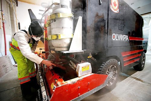 JOHN WOODS / WINNIPEG FREE PRESS
Taylor Brandt, recreation facility operator at East St Paul Community Centre, prepares the ice resurfacer in the indoor rink at the community centre Monday, February 14, 2022. Brandt has been driving an ice resurfacer for the past year. Brandt also does landscaping at the centre during the summer months.

Re: Small