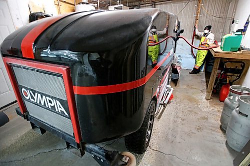 JOHN WOODS / WINNIPEG FREE PRESS
Taylor Brandt, recreation facility operator at East St Paul Community Centre, fills the ice resurfacer in the indoor rink at the community centre Monday, February 14, 2022. Brandt has been driving an ice resurfacer for the past year. Brandt also does landscaping at the centre during the summer months.

Re: Small