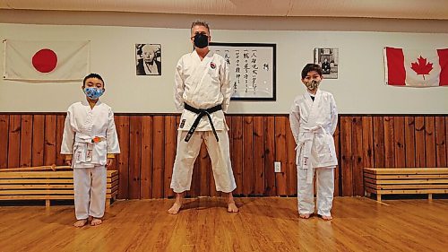 Canstar Community News Sensei Steve Burch poses with two of his white belt students at Kildonan Karate, 1115 Henderson Hwy.