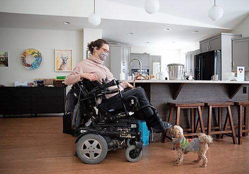 JESSICA LEE / WINNIPEG FREE PRESS

Yvette Cenerini, a digital collage maker and a wheelchair user, is photographed at her home with her dog Jasper on February 15, 2022, in St. Boniface.

Reporter: Eva
